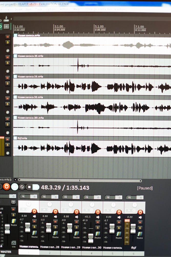 Close-up of an audio editing software interface showing sound wave patterns.